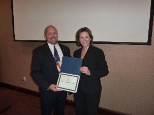 Hart thanks Jacqueline Janning, chief, Business Operations Division, Air Force Research Laboratory, for her speech at the August luncheon.